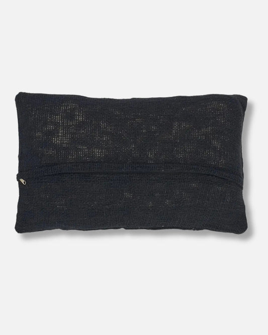 A rectangular black knit throw pillow back with zip, shown against a light grey background.