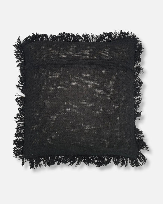 A square black textured throw pillow with fringed edges, shown against a light gray background.