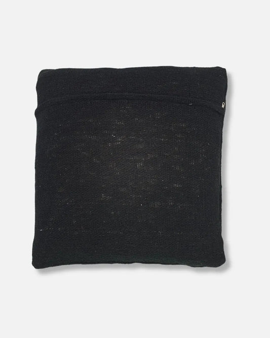 A square black textured throw pillow with a subtle horizontal seam covering zipper for cleaning, shown against a plain light grey background.