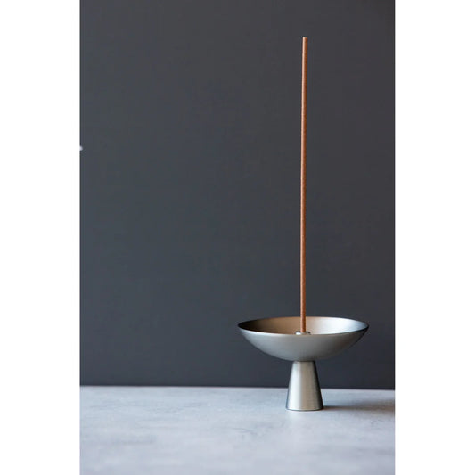 Alta Saturn Incense Holder showcasing its silvery hue and design