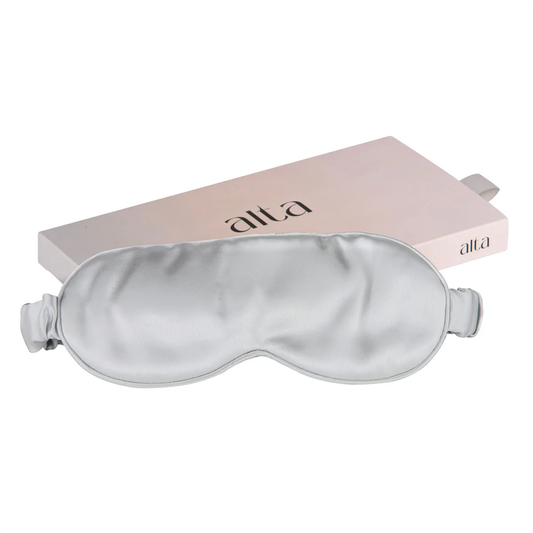Moonstone Grey silk eye mask for luxury spa sleep sitting on the box it comes in.