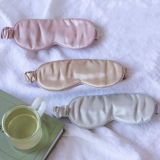Luxury silk spa eye mask in moonstone grey, cream and pink.