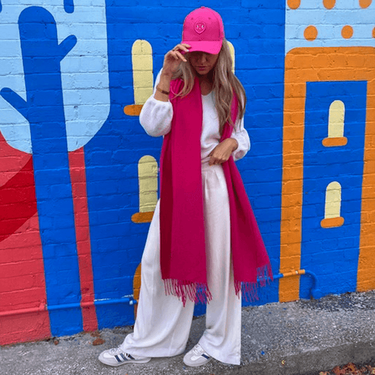 The Dark Hampton Cooper Wool Blanket Scarf as worn by a model to show how effortlessly chic it looks on.