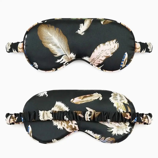 Close-up of the Feather Satin Eye Mask showcasing both sides and its silky texture