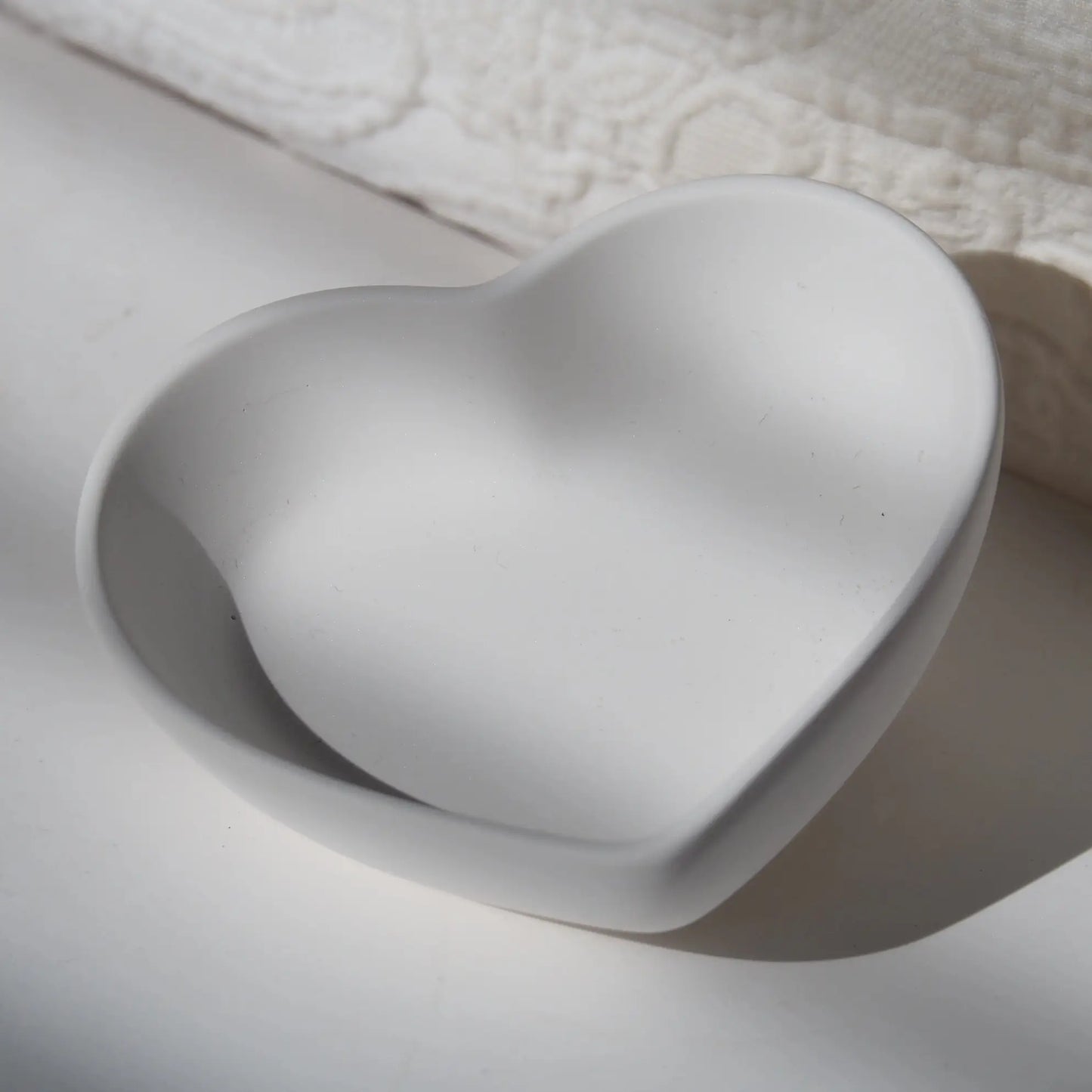 Decorative heart shaped jewellery dish for vanity or dresser.