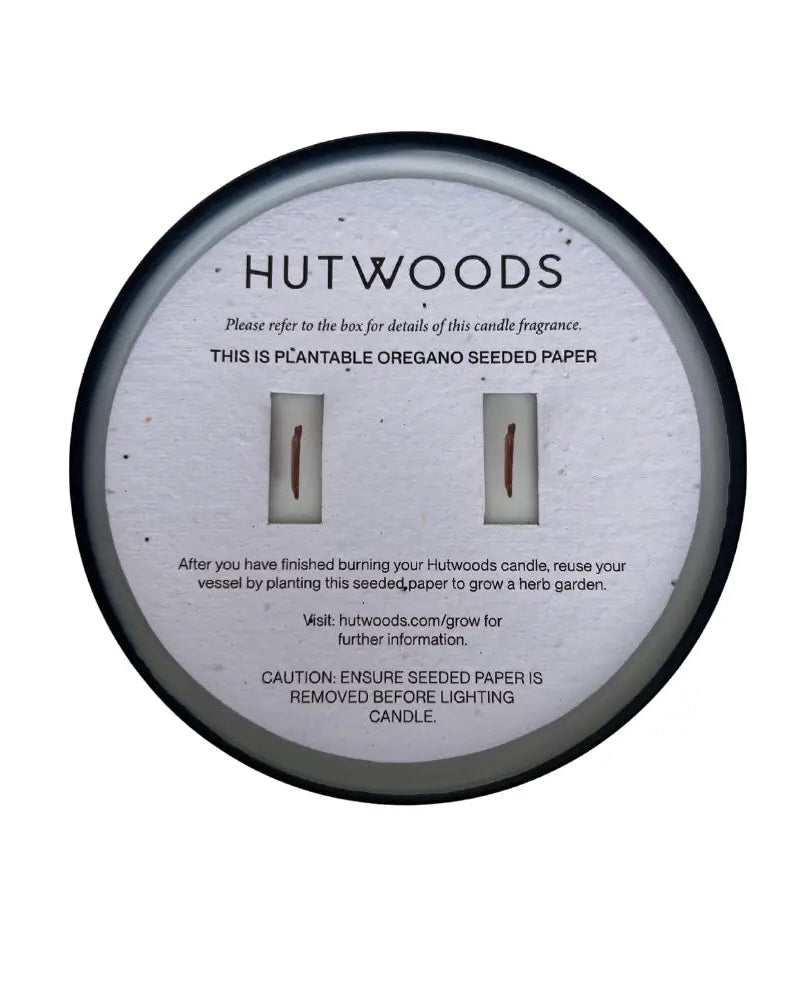 Top view of the Hutwoods large black candle with seeded paper topper