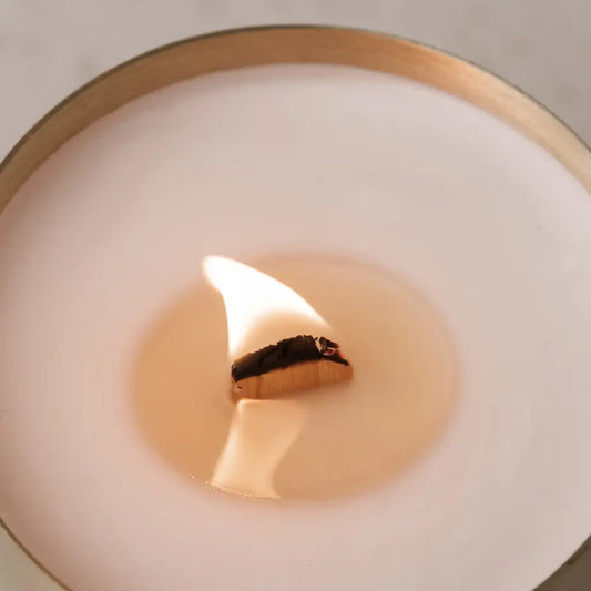 Close up of a Hutwood brass/cold candle with wood wick - I can hear the subtle crackle of the wick. Divine.