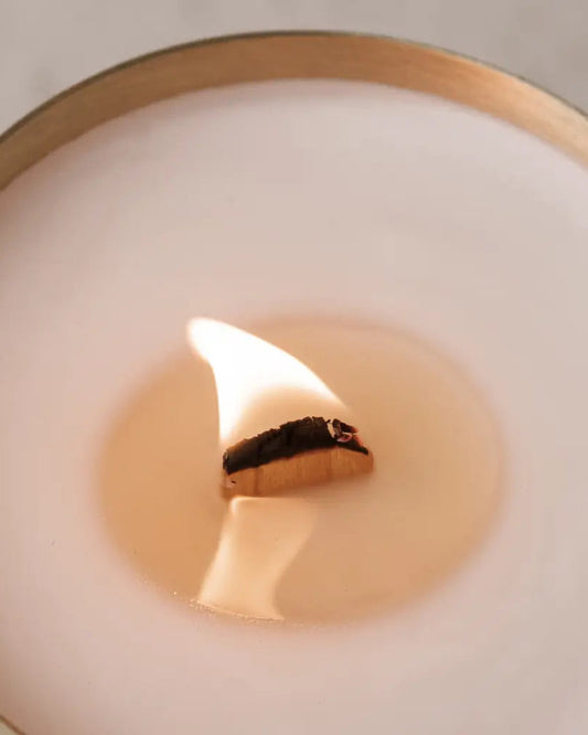 Close up of a Hutwood brass/cold candle with wood wick - I can hear the subtle crackle of the wick. Divine.