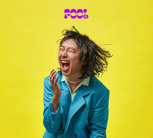 Someone playing Fool the Game, a travel-friendly acting and guessing card game resulting in lots of laughs.