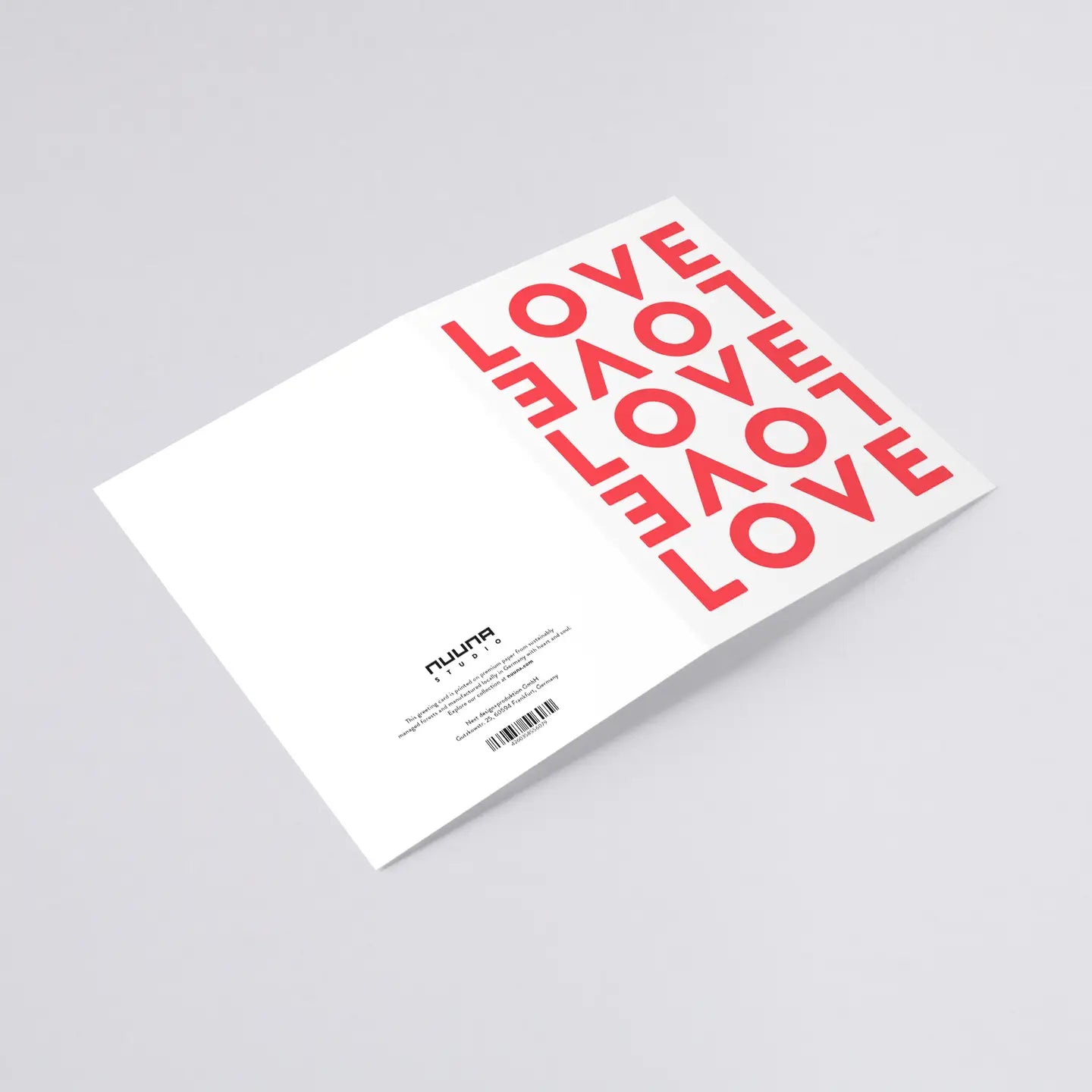 Flat lay of the Nuuna LOVE greeting card that comes with a red envelope, premium design.