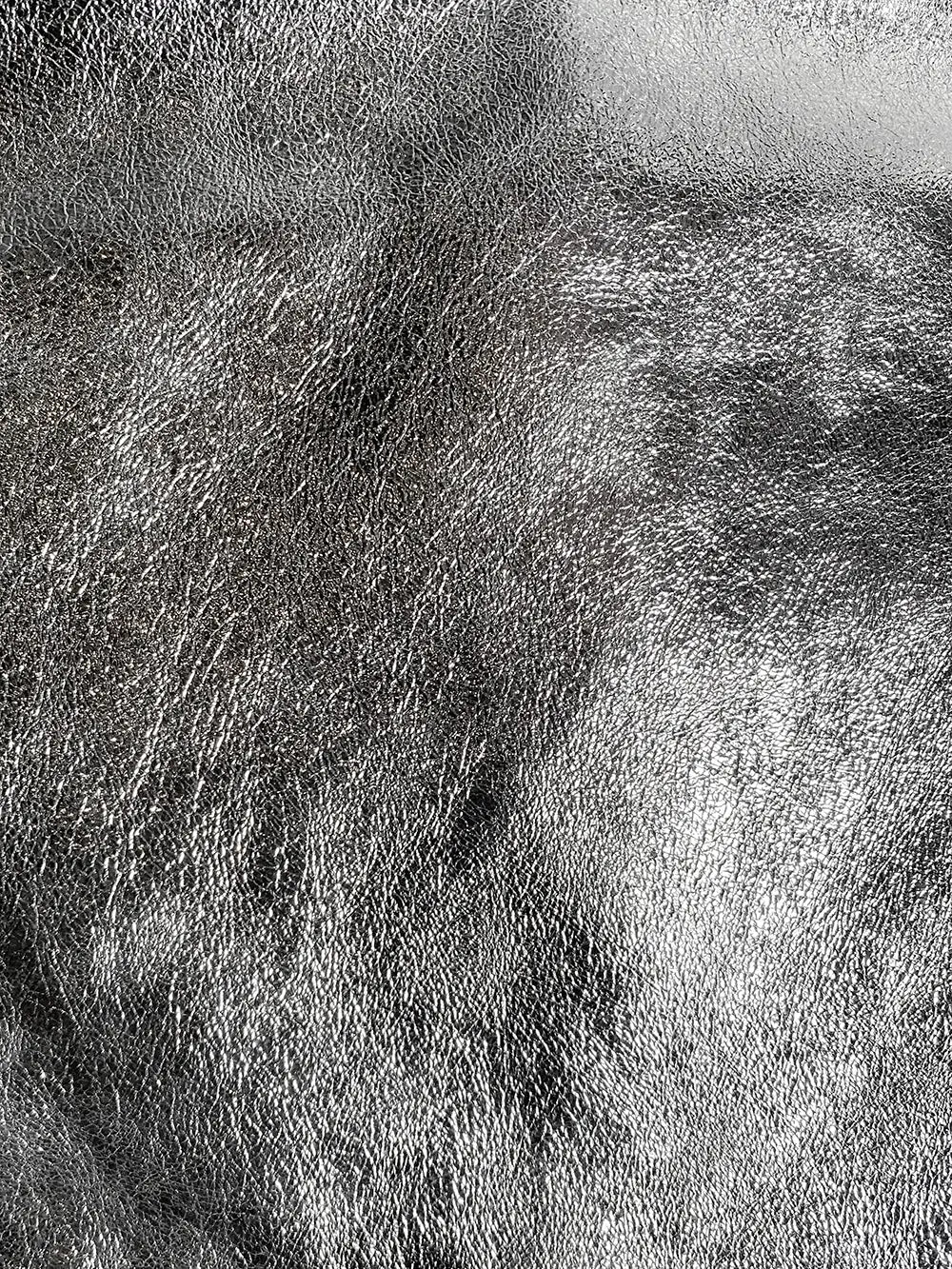 Close up of the gorgeous metallic finish of the leather on the Silver metallic Maison Fanli large tote bag.