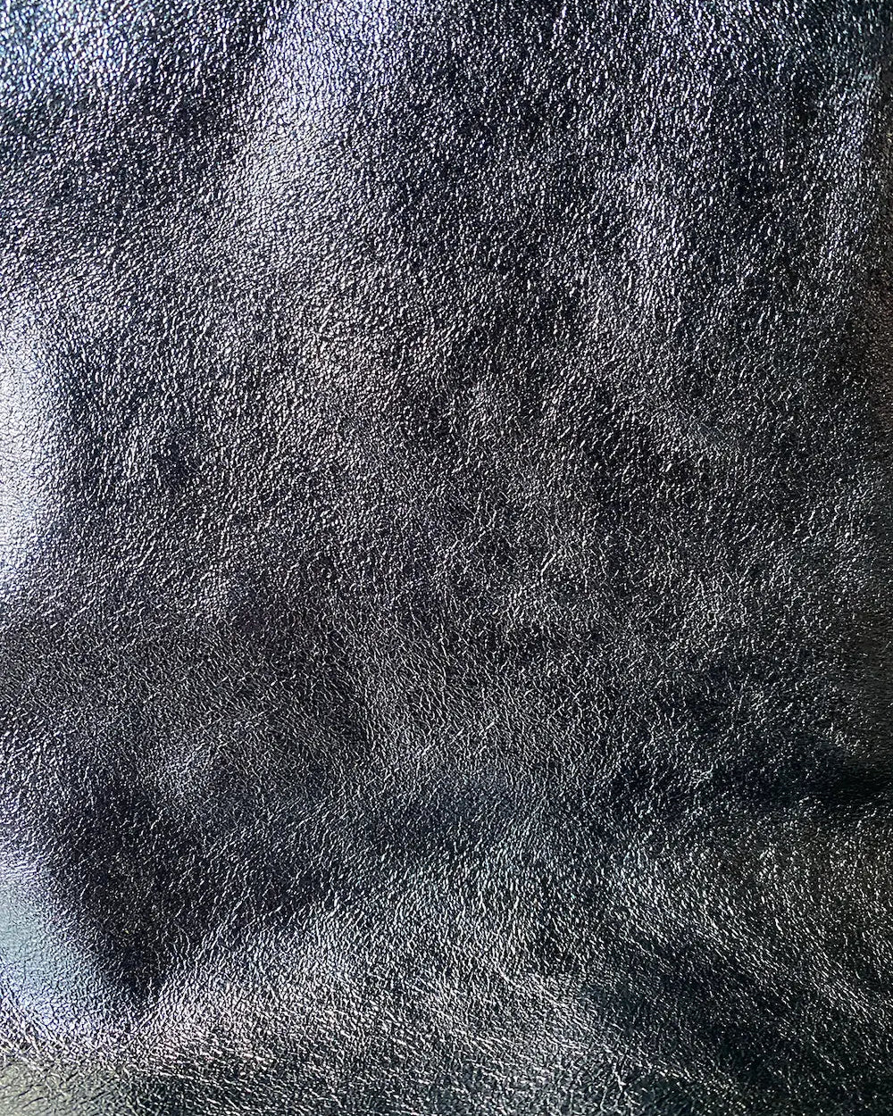 Close-up detail of the leather on the Maison Fanli Large Tote in Metallic in Grey. Gorgeous and durable.