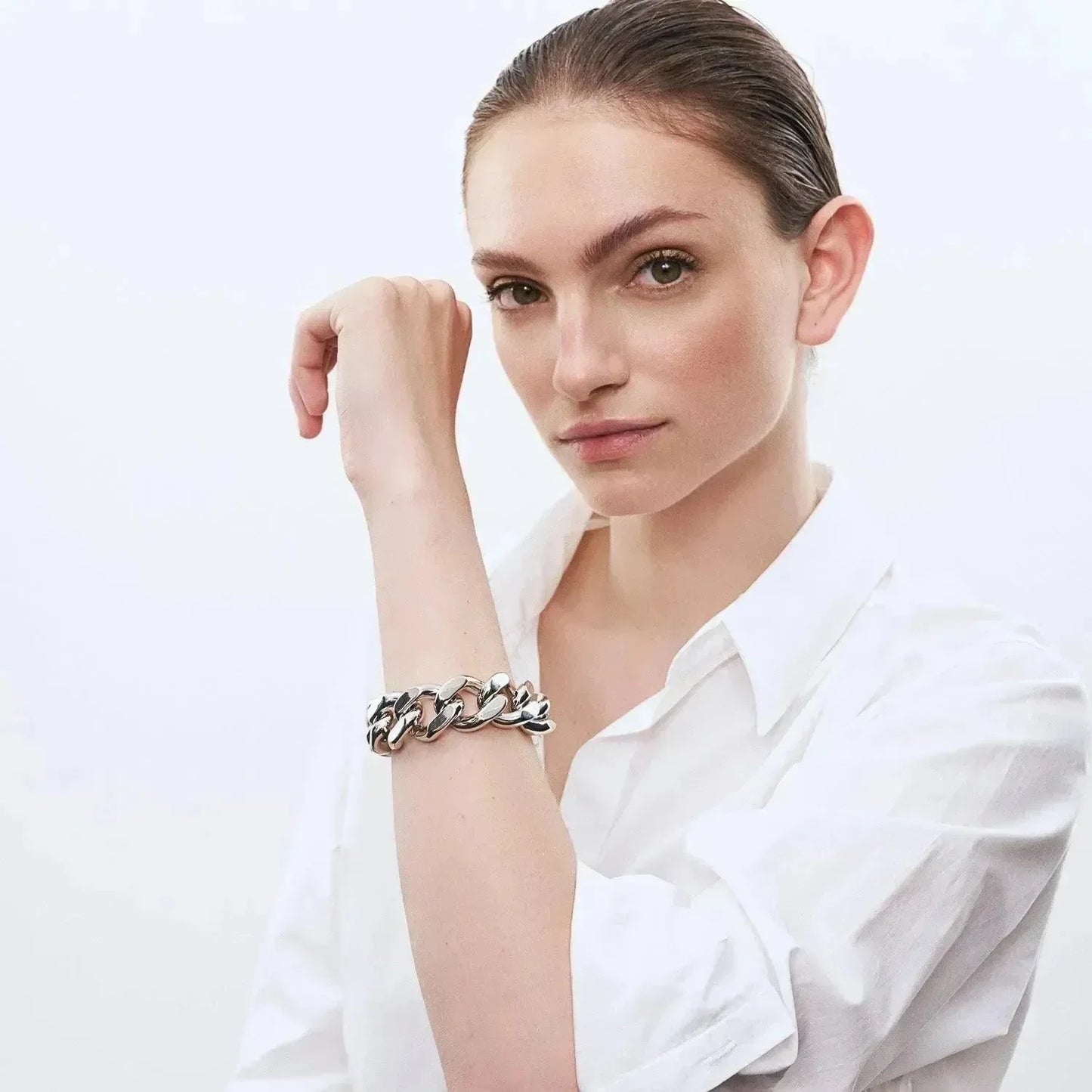 Woman wearing The Vanessa Baroni silver chain bracelet on her left wrist... gorgous.