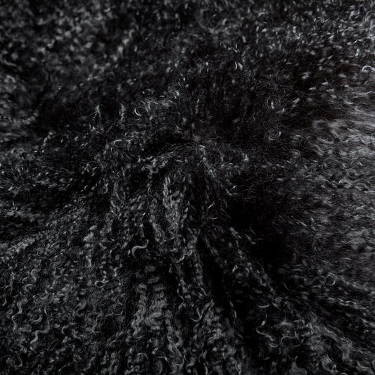 Close up of the Black Mongolian Sheepskin Cushion to give you an indication of how soft and luxurious it feels.
