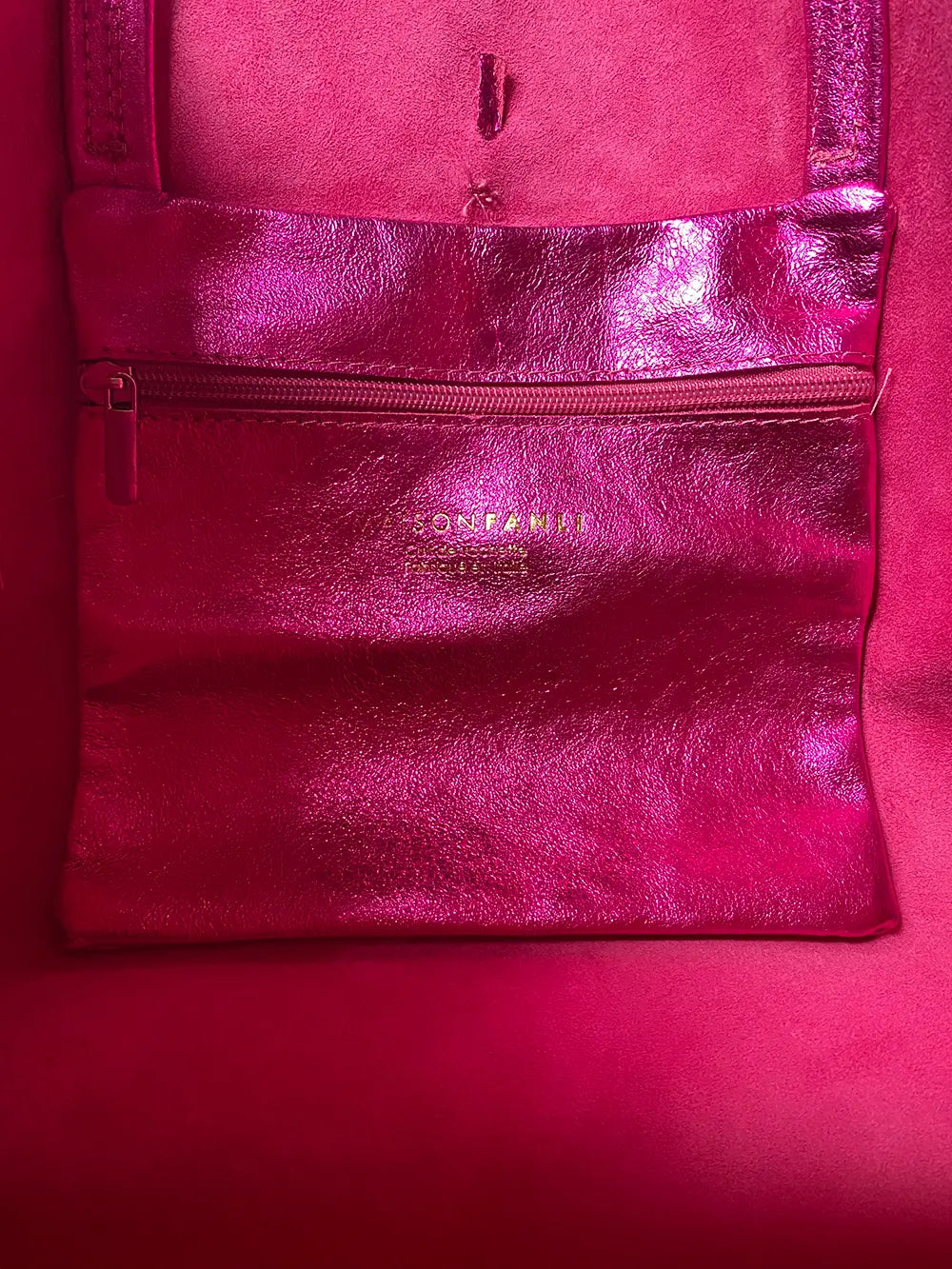 Internal attached pocket with zipper to keep small items secure.