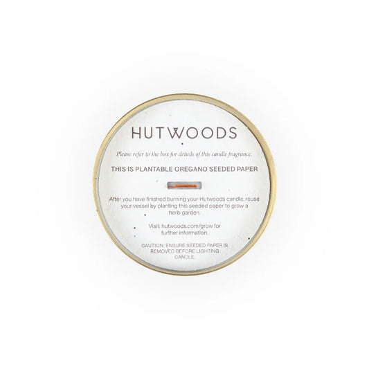 Top view of the brass/gold Hutwood candles with their signature seeded paper ready to plant in your garden or kitchen window sill