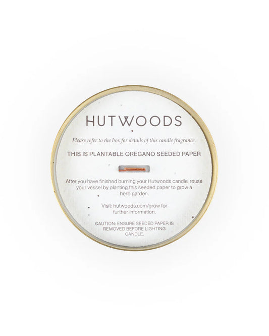 Top view of the brass/gold Hutwood candles with their signature seeded paper ready to plant in your garden or kitchen window sill