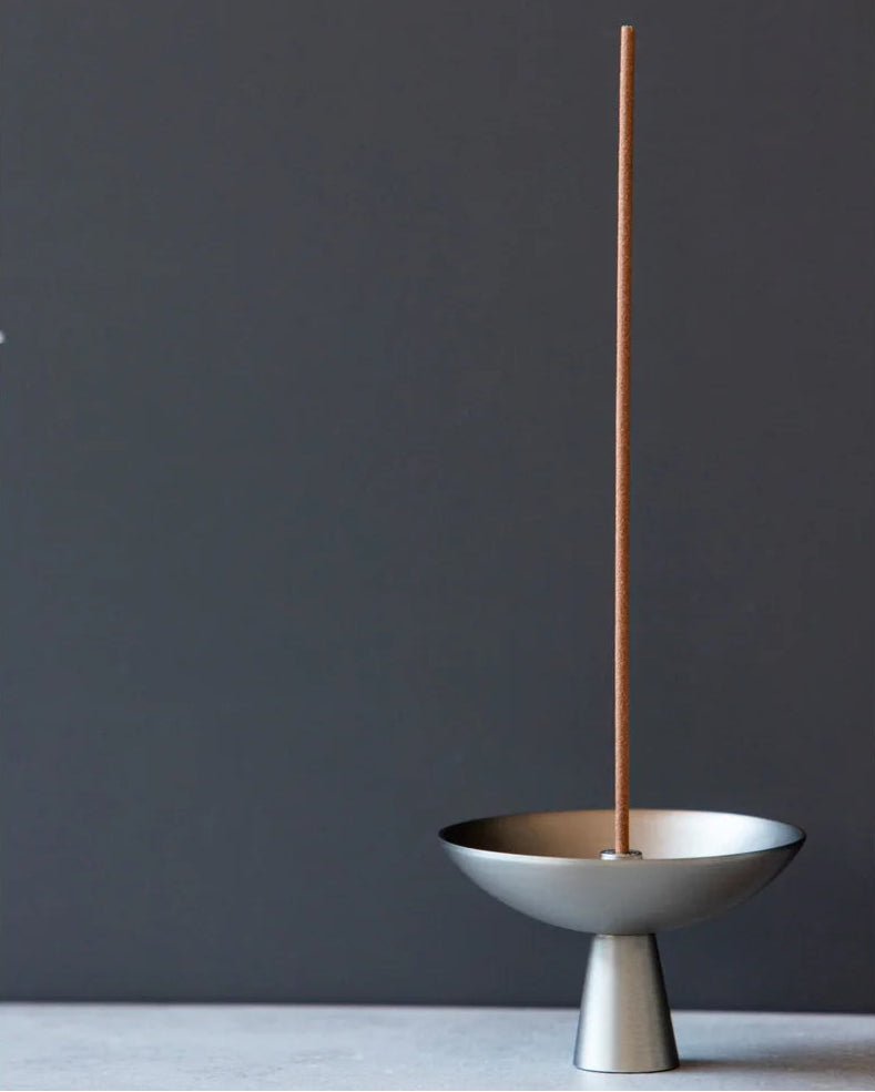 Alta Saturn Incense Holder showcasing its silvery hue and design