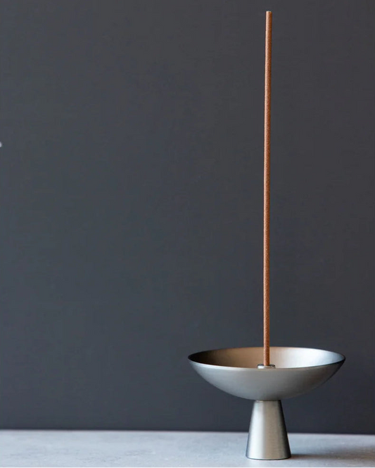 Alta Saturn Incense Holder showcasing its silvery hue and design