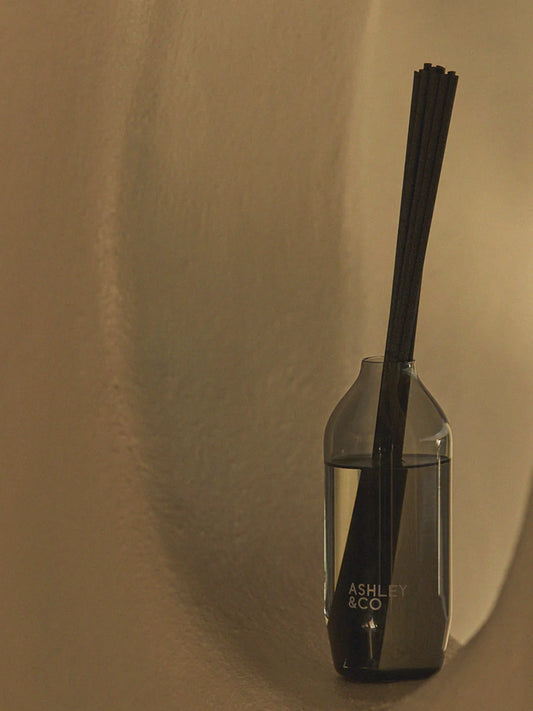 Ashley & Co Tui & Kahili Home Perfume Reed Diffuser in a wall alcove looking very stylish