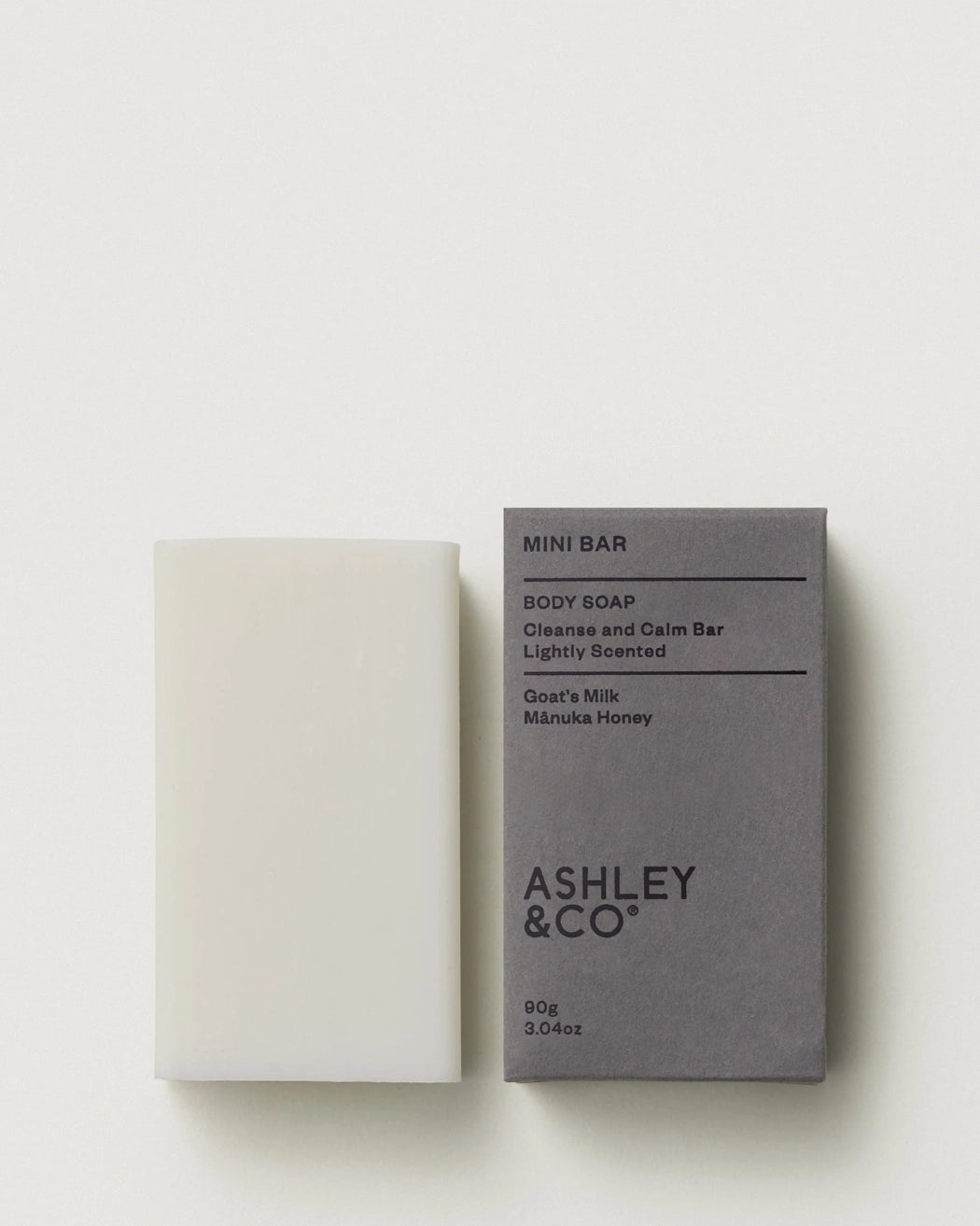 Ashley and Co Parakeets Pearls Mini Bar Body Soap next to it's grey cardboard packaging box on a white background.