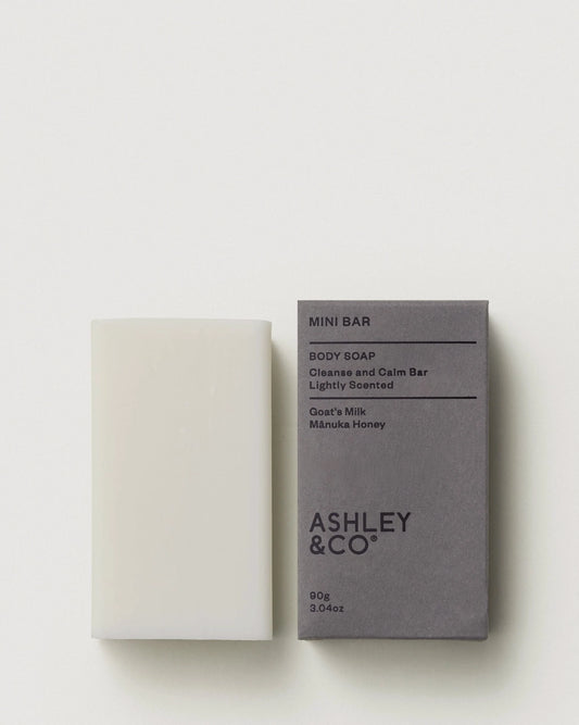 Ashley and Co Parakeets Pearls Mini Bar Body Soap next to it's grey cardboard packaging box on a white background.