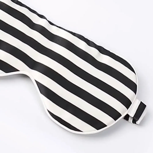 Close-up of the Black & White Striped Silk Sleep Mask