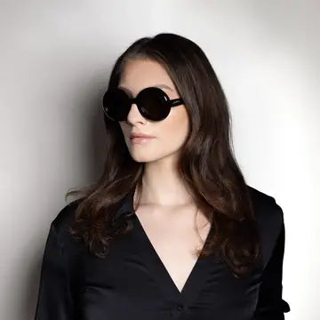 Jackie O oversized black sunglasses worn