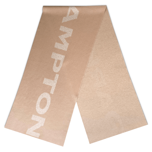 The Thompson Wool Scarf flat laid on a white background. Timeless style and elegance. 