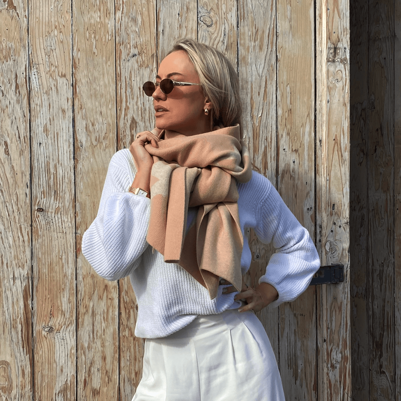 A model wearing the Thompson Wool Scarf to highlight how versatile and stylish it is.