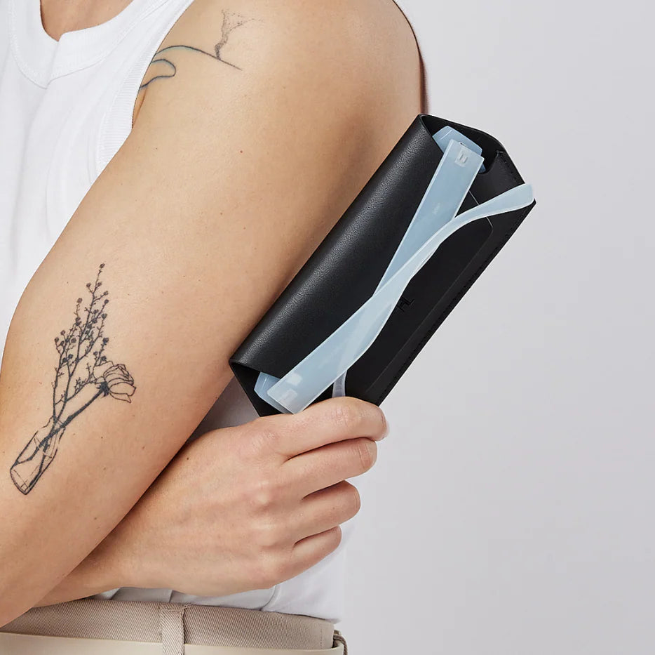 Person holding a black Fox and Leo glasses or sunglasses case in Black