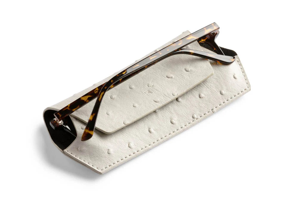 Textured ostrich leather sunglasses case, compact and durable.
