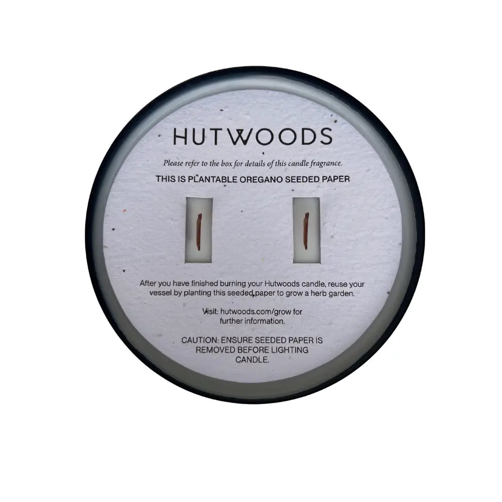 Top view of the Hutwoods large black candle with seeded paper topper
