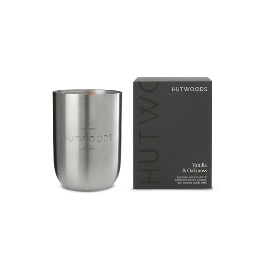 Unlit Hutwoods Vanilla & Oakmoss Candle showcasing sleek packaging