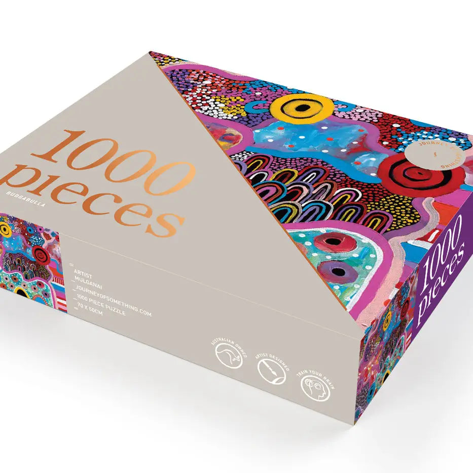 Budgabulla 1000-piece puzzle box showcasing Mulganai’s vibrant Indigenous artwork.