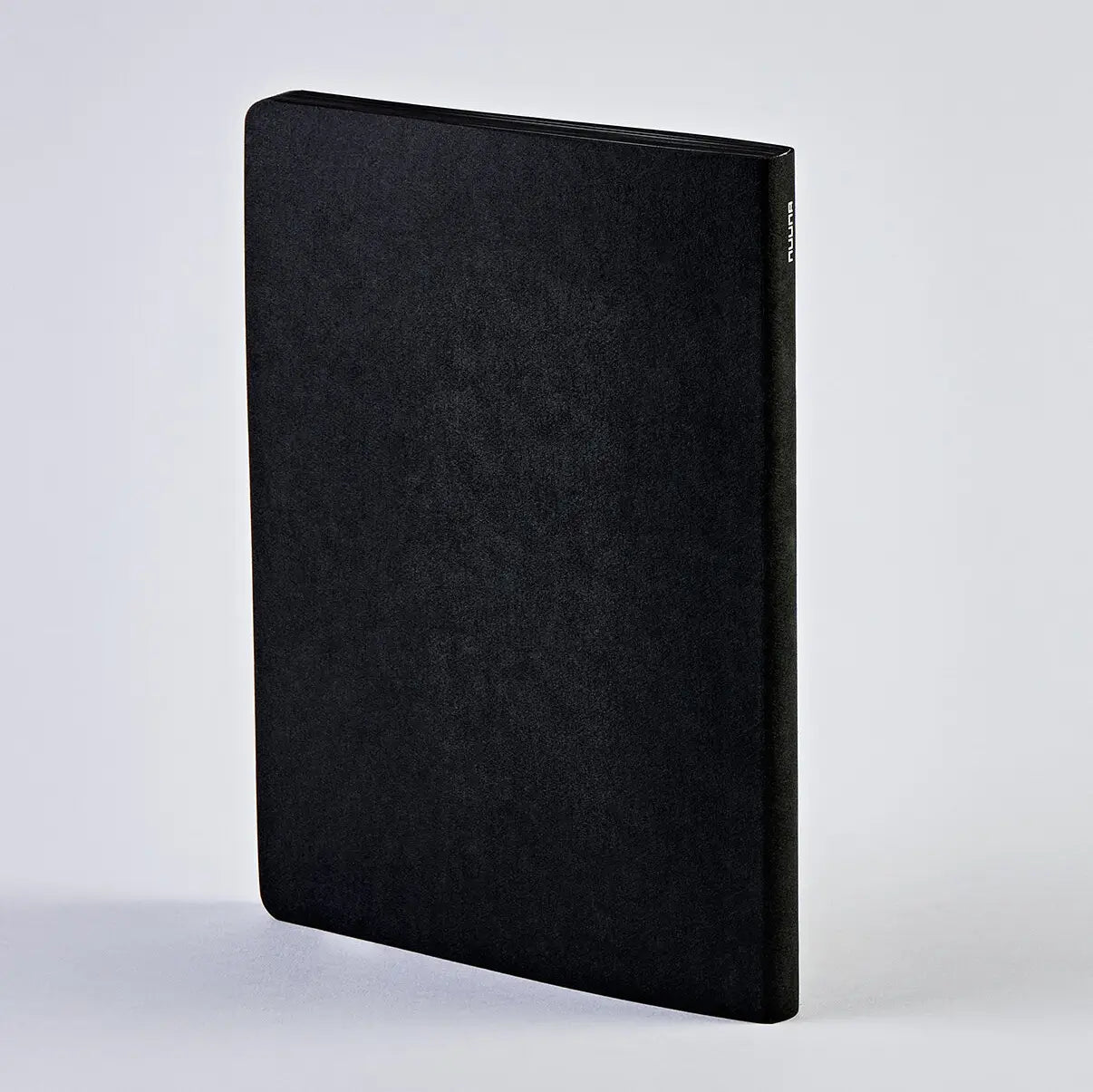 Nuuna black Rebel with a Cause notebook as seen from behind... plain black back cover... also this is vegan leather with 176 pages.