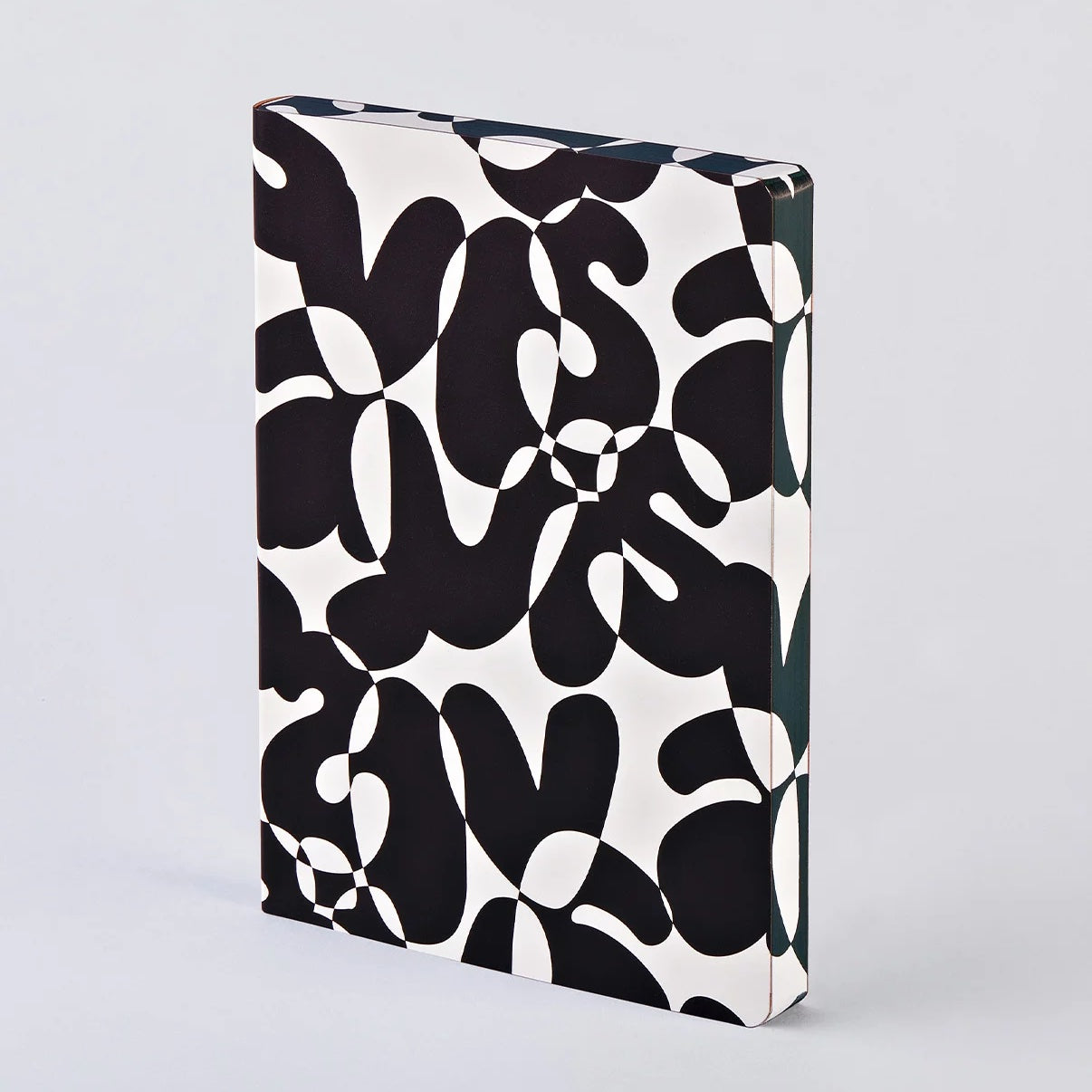 Nuuna ‘VIS-À-VIS’ A5+ notebook with monochrome abstract design on recycled leather cover.