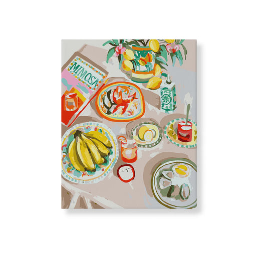 A paint-by-numbers kit image featuring a colourful depiction of a meal with prawns, bananas, and oysters on a table, framed and ready to hang.