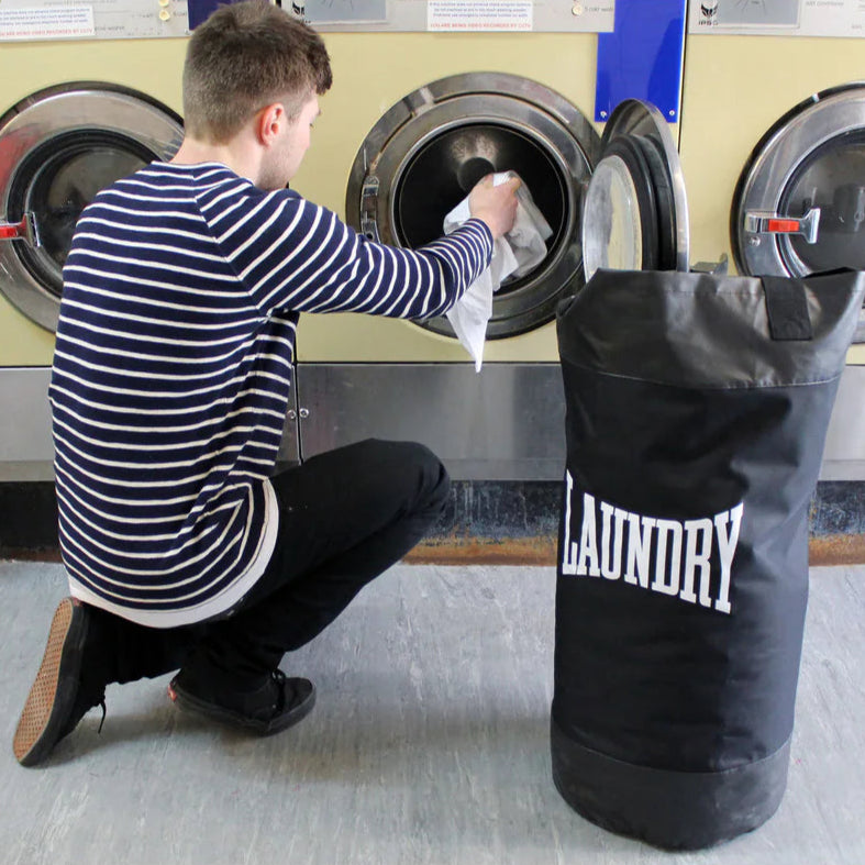 Open Suck UK Punch Boxing Laundry Bag in a laundromat 