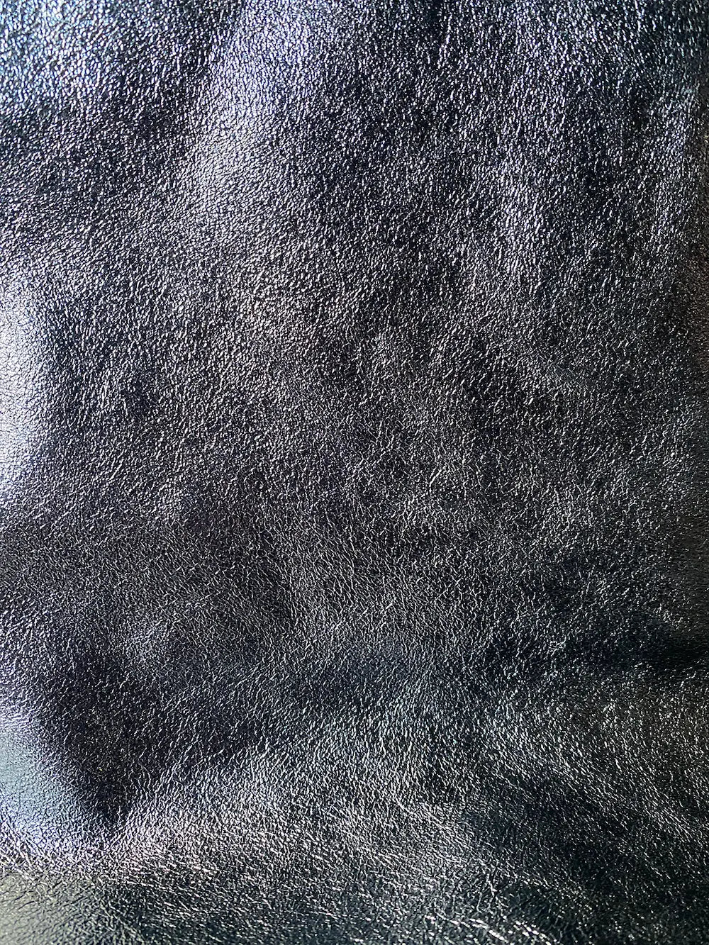 Close-up detail of the leather on the Maison Fanli Large Tote in Metallic in Grey. Gorgeous and durable. 