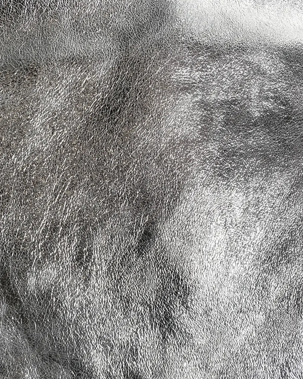 Close-up detail of the leather on the Maison Fanli Large Tote in Metallic in Silver. Gorgeous and durable. 