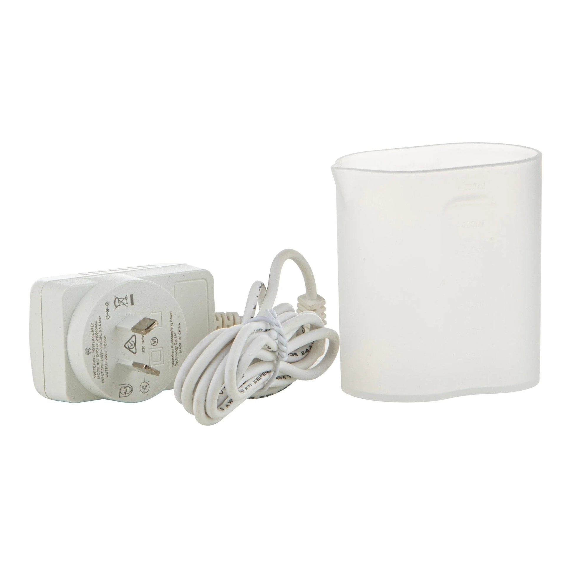 White ceramic ultrasonic diffuser accessories: plug and a jug to fill it up with fresh water.