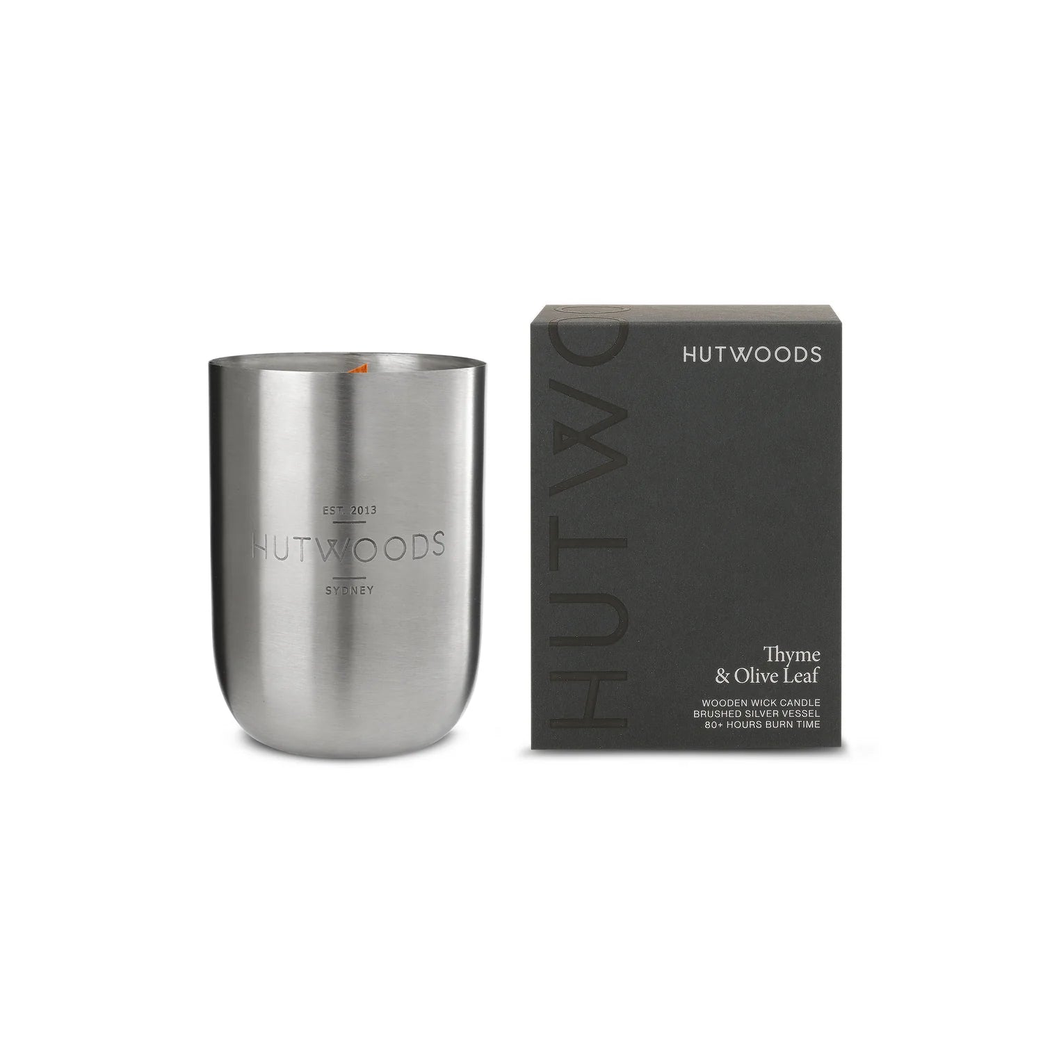 Hutwoods Thyme & Olive Leaf Candle in brushed silver vessel with seeded herb paper topper