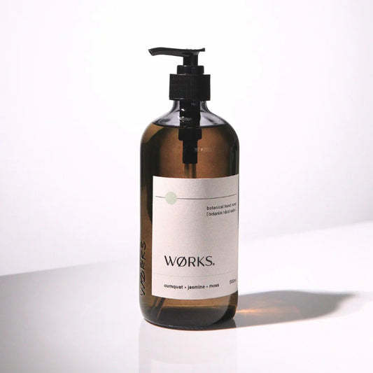 WØRKS cumquat liquid hand soap in smoky-grey glass bottle, 500ml.