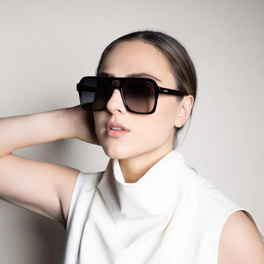 Gifts for the Hard-to-Buy-For: Model wearing Donna black oversized sunglasses