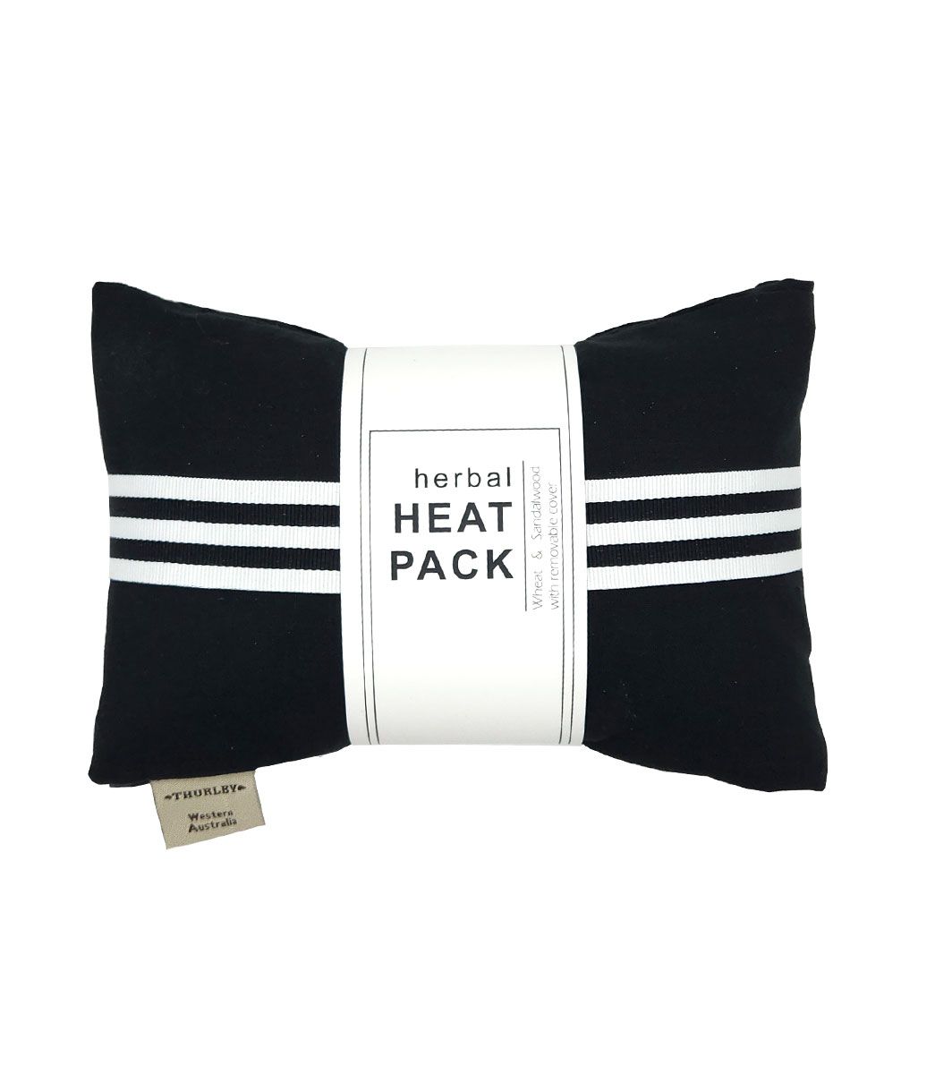 A black heat pack with a triple white stripe across the middle and a white label saying 'herbal HEAT PACK' on it.