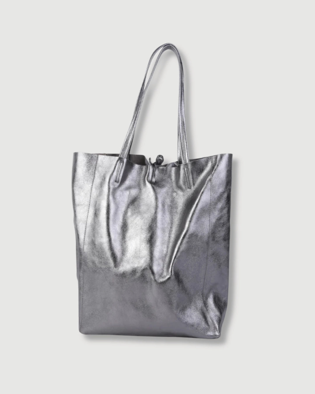 Metallic leather tote bag in gunmetal grey with spacious interior and soft leather finish