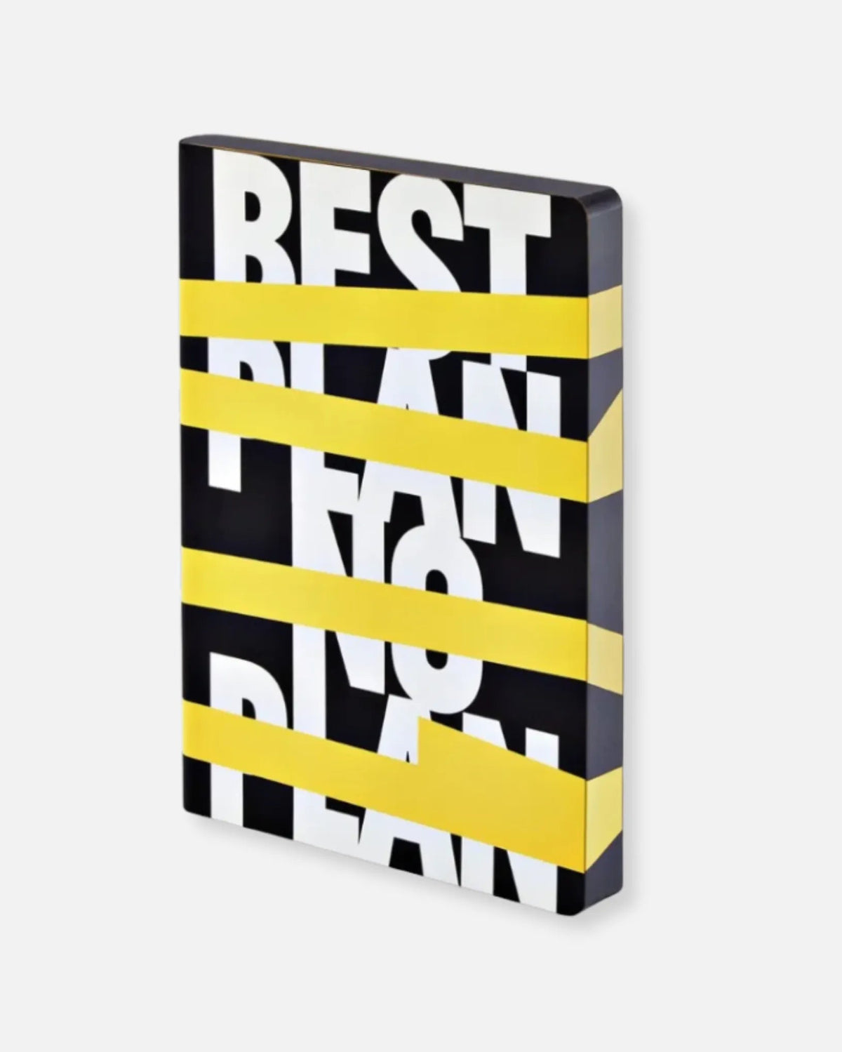 Nuuna “Best Plan. No Plan” notebook with smooth bonded leather cover and wraparound graphic design, photographed on a light grey background.