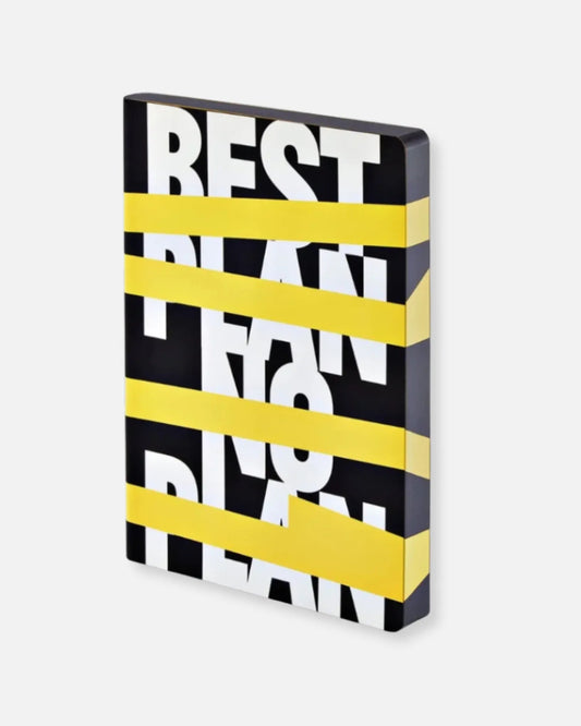 Nuuna “Best Plan. No Plan” notebook with smooth bonded leather cover and wraparound graphic design, photographed on a light grey background.