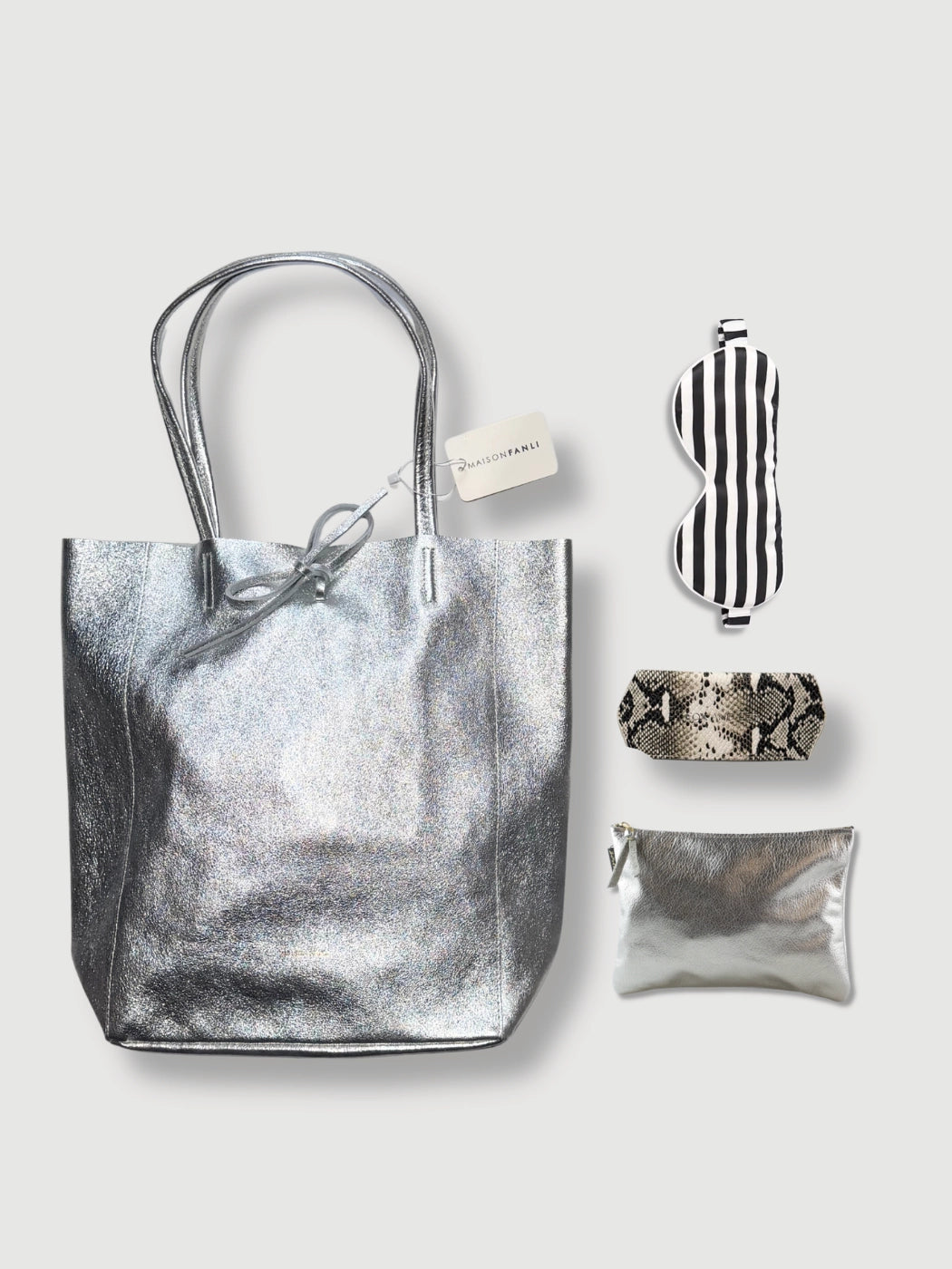 Luxe Wanderer chic travel gift set with silver Italian leather tote, silk sleep mask, snake print glasses case and metallic pouch
